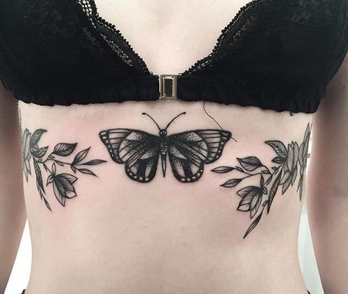 Help me redesign looking for concept art for a sternum tattoo Id like  something similar but with a peony  a small spider hanging from the  bottom Looking for something feminine 