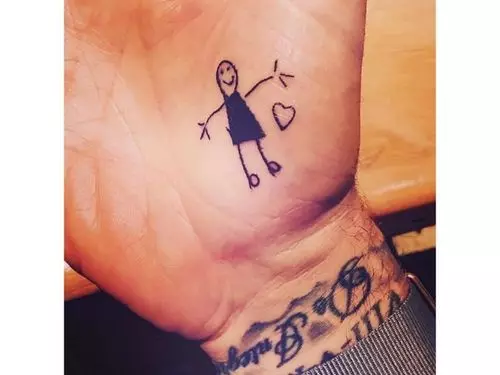 David Beckham's back and arm's tattoos.