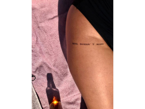 Coralline quote tattoo on the lower thigh Done with a 5rs The quote reads  You probably think this world is a dream come true but youre wrong my  first lettering tattoo 