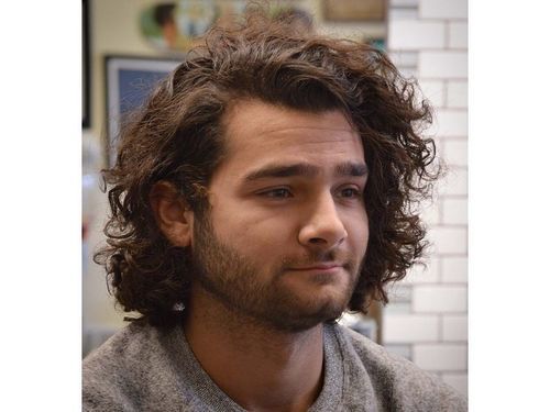 Image of Messy waves oblong face hairstyle male