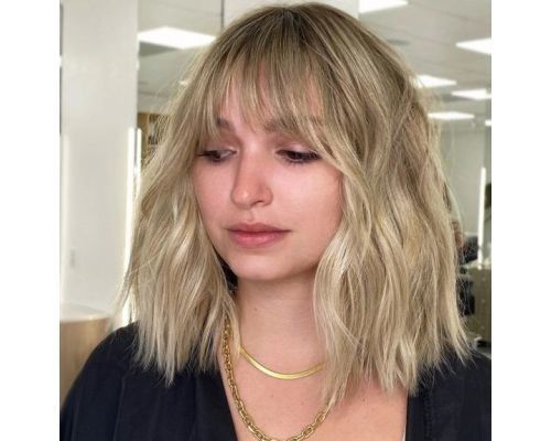 Image of Shaggy blonde lob with wispy bangs