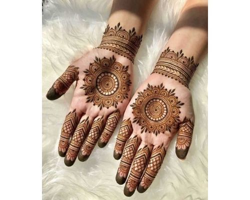 Top down video of a woman copying the mehndi henna tattoo from one hand to  the other in preparation of the hindu festival of teej, karwachauth, diwali  Stock Photo - Alamy