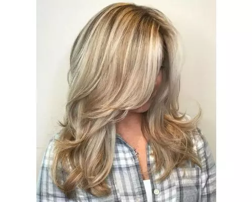 24 Blonde Layers On Sweeping Locks