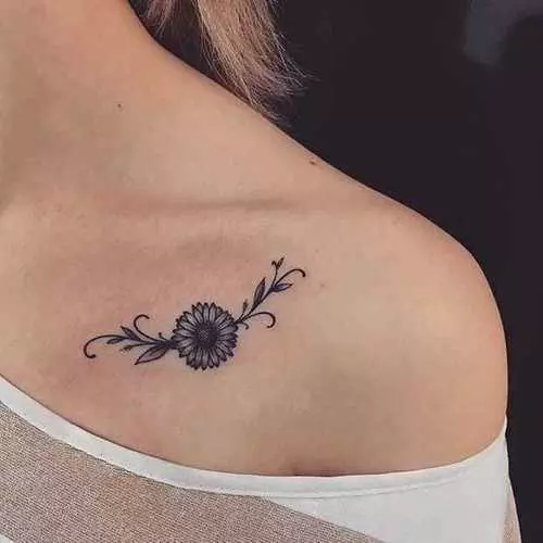 Open book with daisies and a sunflower tattoo idea | TattoosAI