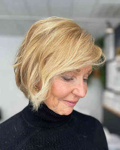 blonde-textured-choppy-bob-with-side-bangs-for-women-in-their-60s