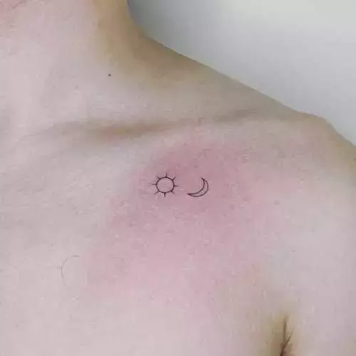 Minimalist sun tattoo on the shoulder.