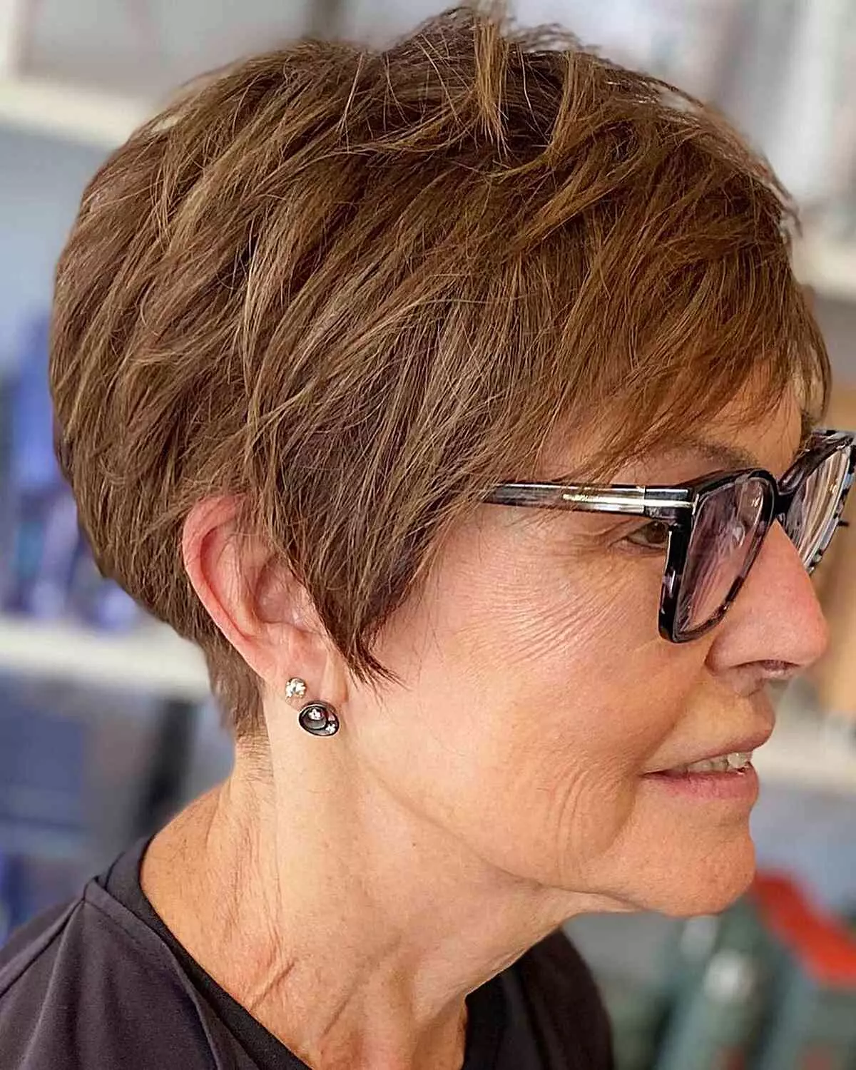 short-pixie-bob-with-highlights-for-ladies-aged-50-with-eyeglasses