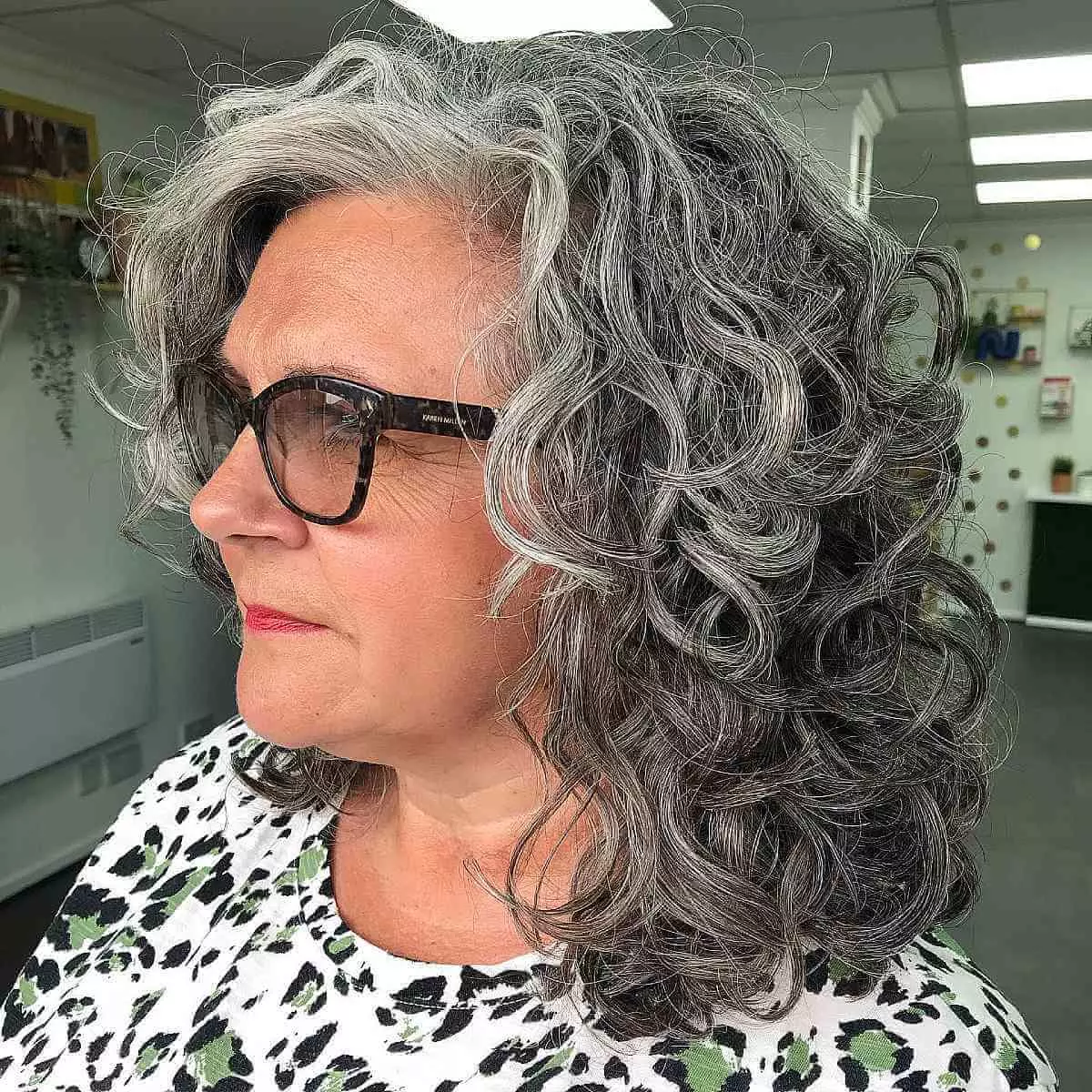 mid-length-gray-curls-for-60-year-olds-with-glasses