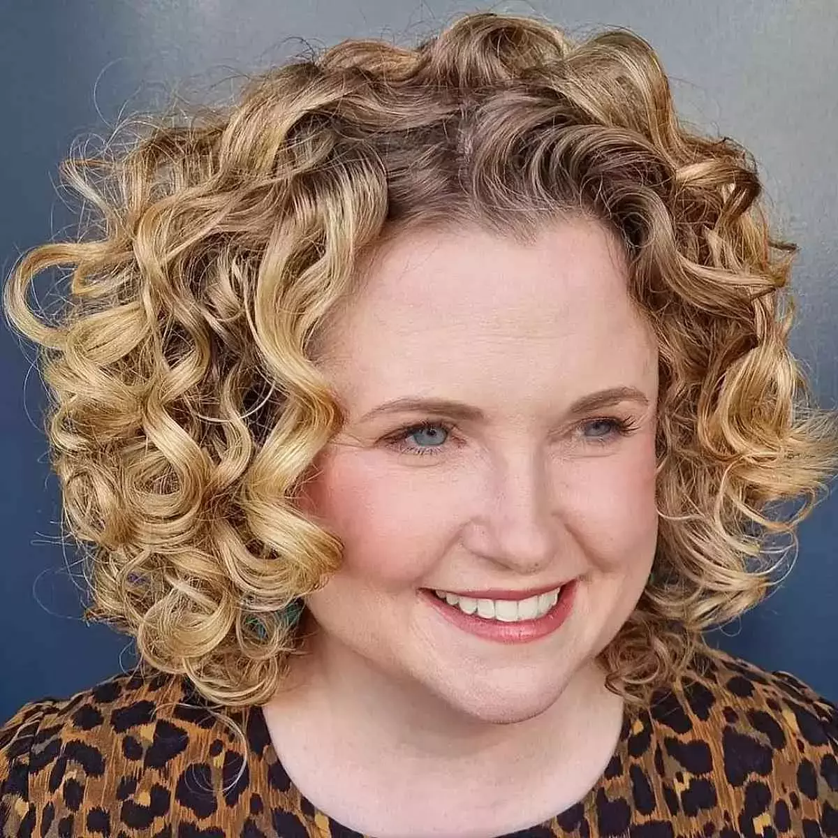 curly-bob-hairstyle-for-ladies-over-fifty-with-round-face-shapes