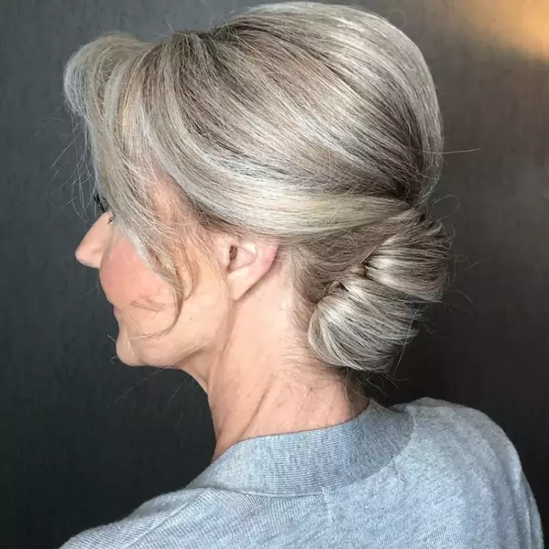sleek-side-swept-bun-mother-of-the-grooms-hairstyle