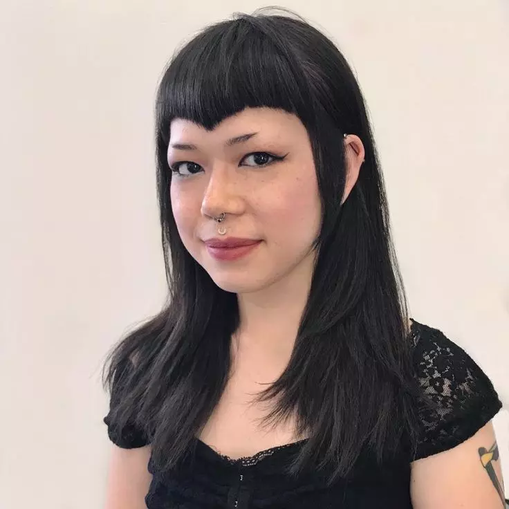 Edgy Face Framing Layered Cut with Curved V Shaped Bangs and Black Hair Color - The Latest Hairstyles for Men and Women (2020) - Hairstyleology