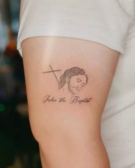 Sleek-Jesus-face-tattoo-on-the-arm