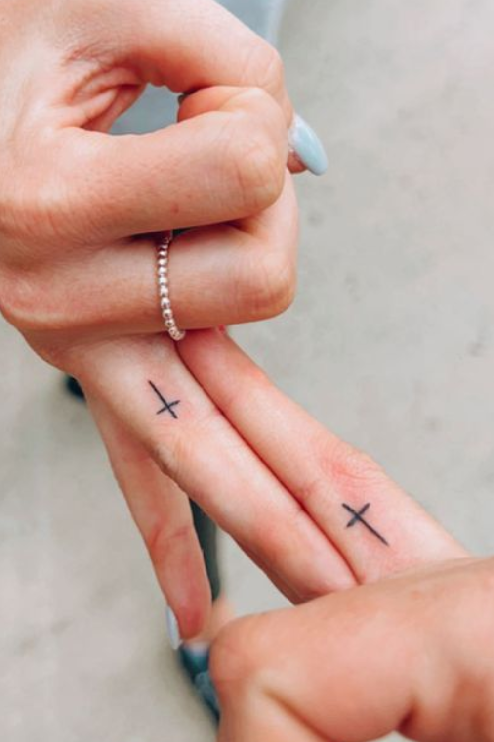 cross-finger-tattoo
