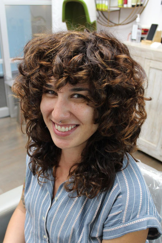 Curly-Wolf-Cut-with-Brown-Highlights