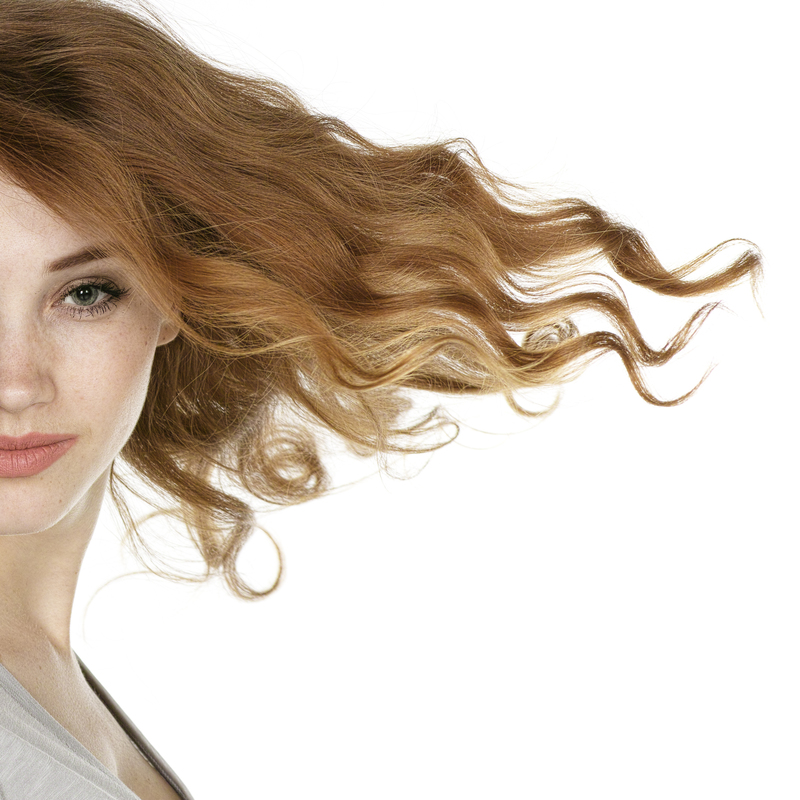 http://www.freepik.com/free-photo/beautiful-redhead-model_892465.htm#term=hair style&page=1&position=13