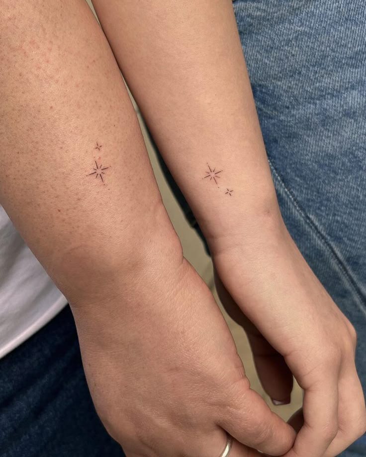 Matching minimalistic star tattoo for mother and…