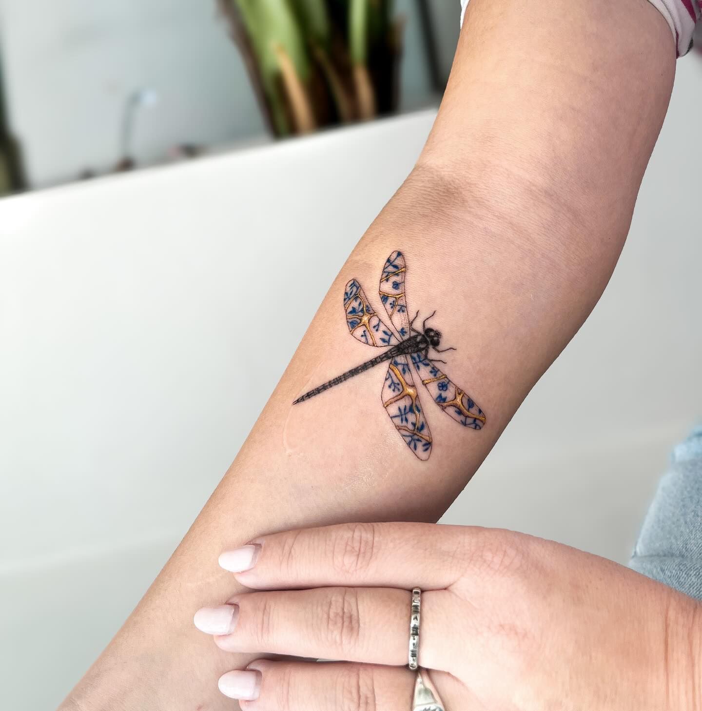 dragonfly-tattoo-with-blue-patterns-on-wings