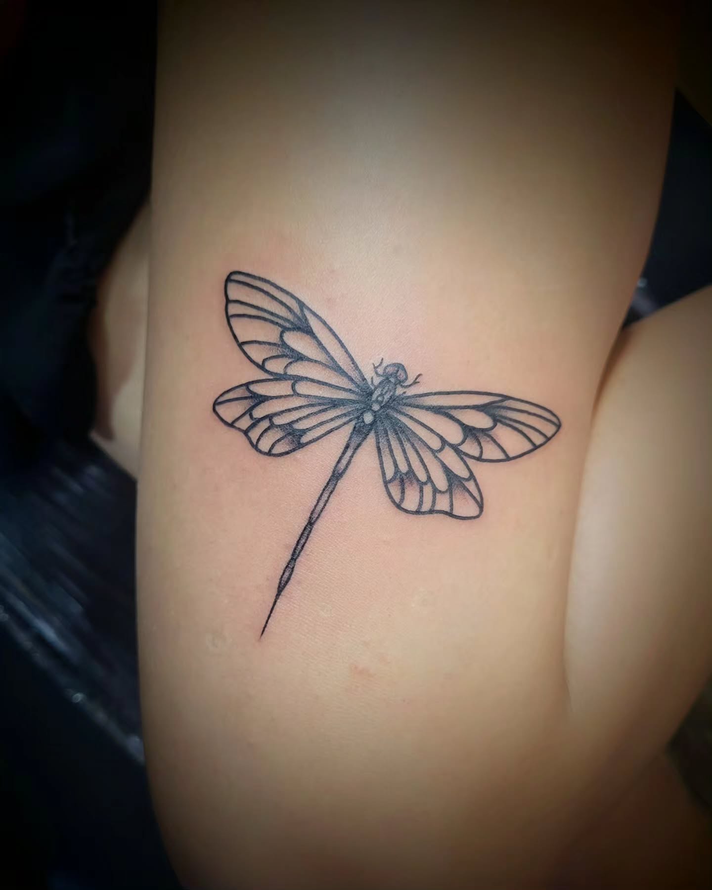 fine-line-dragonfly-tattoo-on-arm