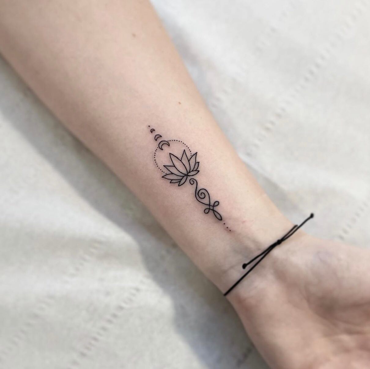 unalome-with-lotus-and-moon