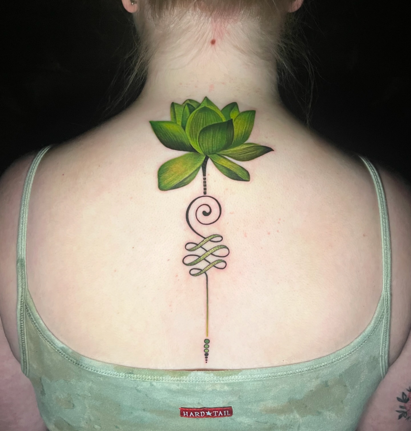 Peridot-lotus-with-unalome-tattoo