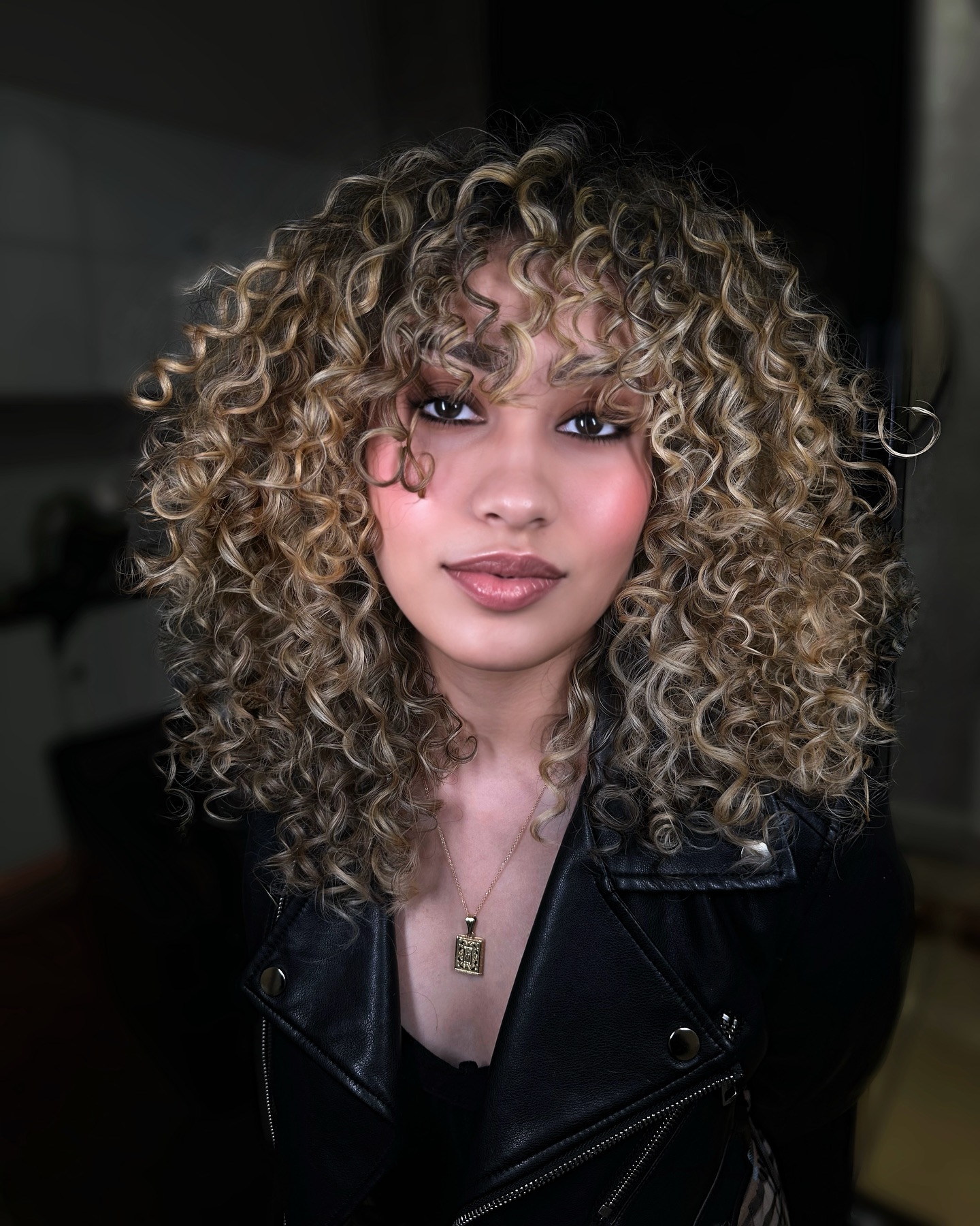 brown-curly-hair-with-bangs