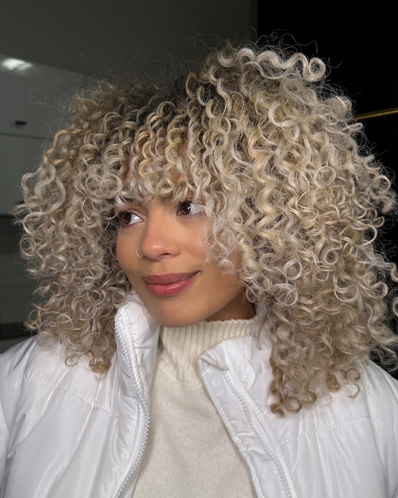 platinum-blonde-curly-haircuts-with-bangs