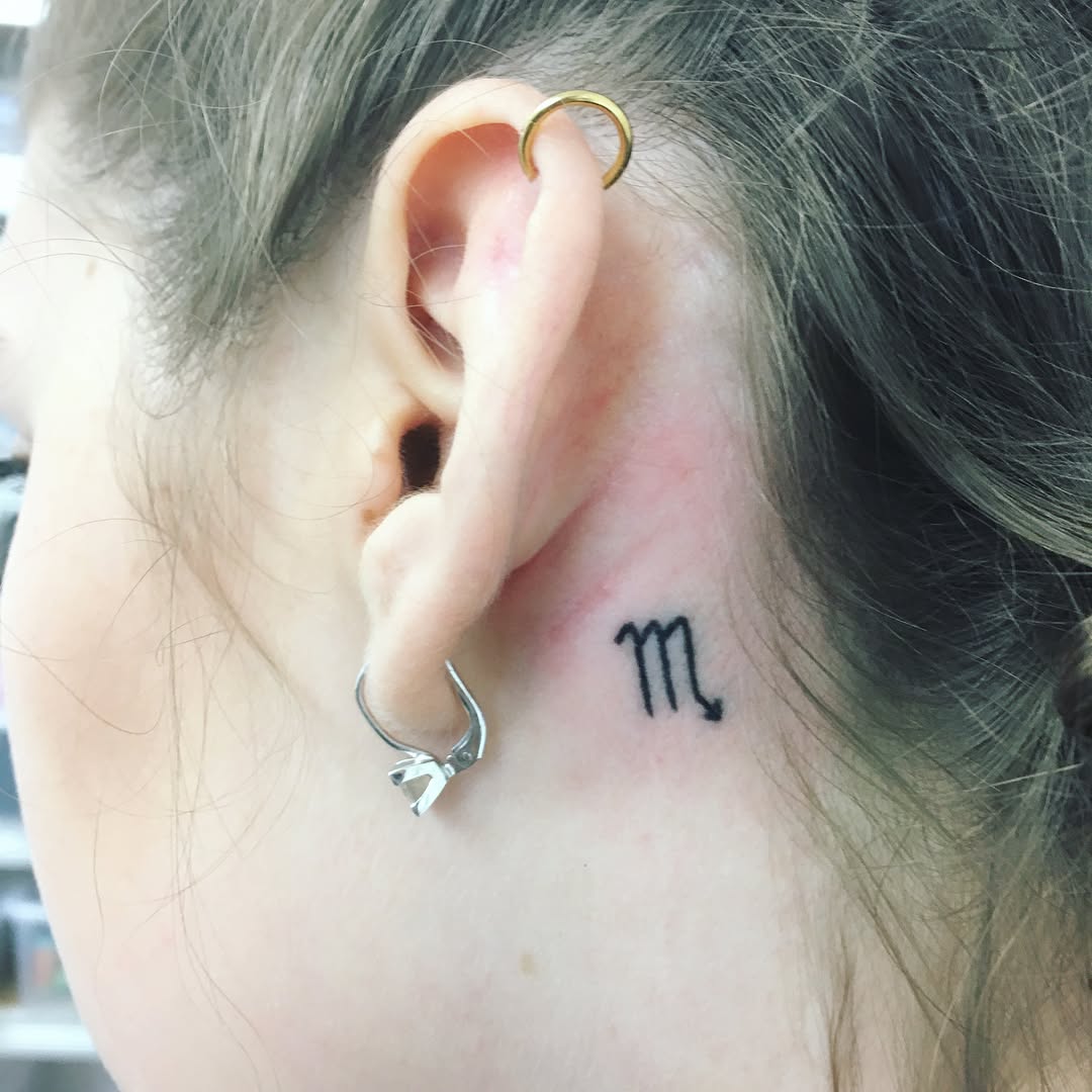 letter-m-behind-ear-tattoo