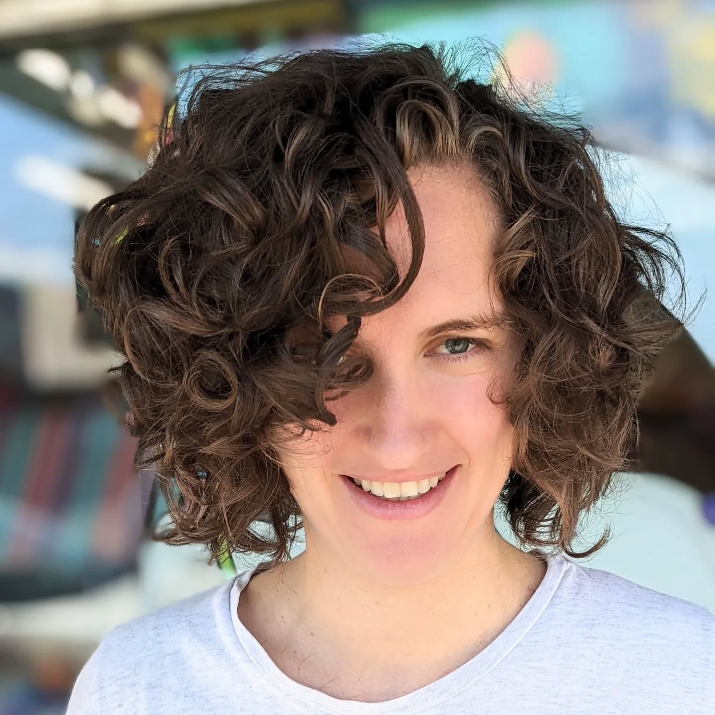 side-parted-brown-short-curls