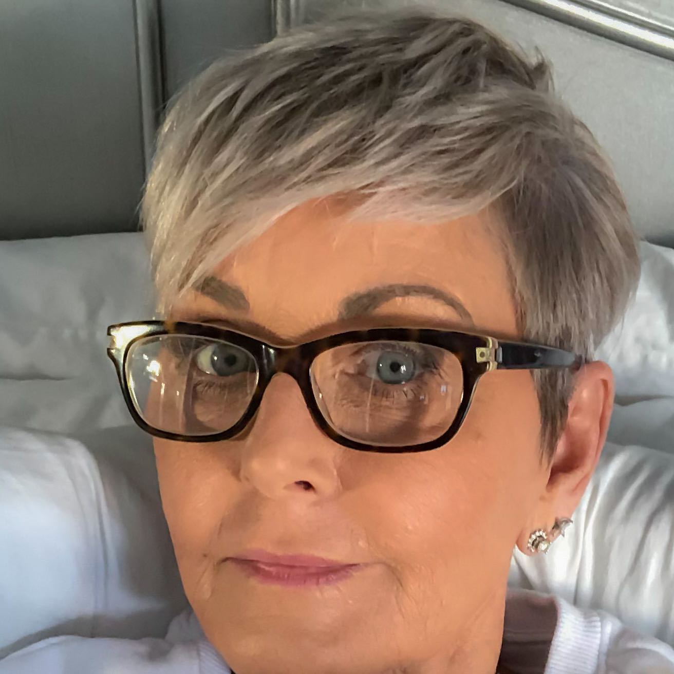 gray-pixie-with-side-bangs-and-thick-glasses