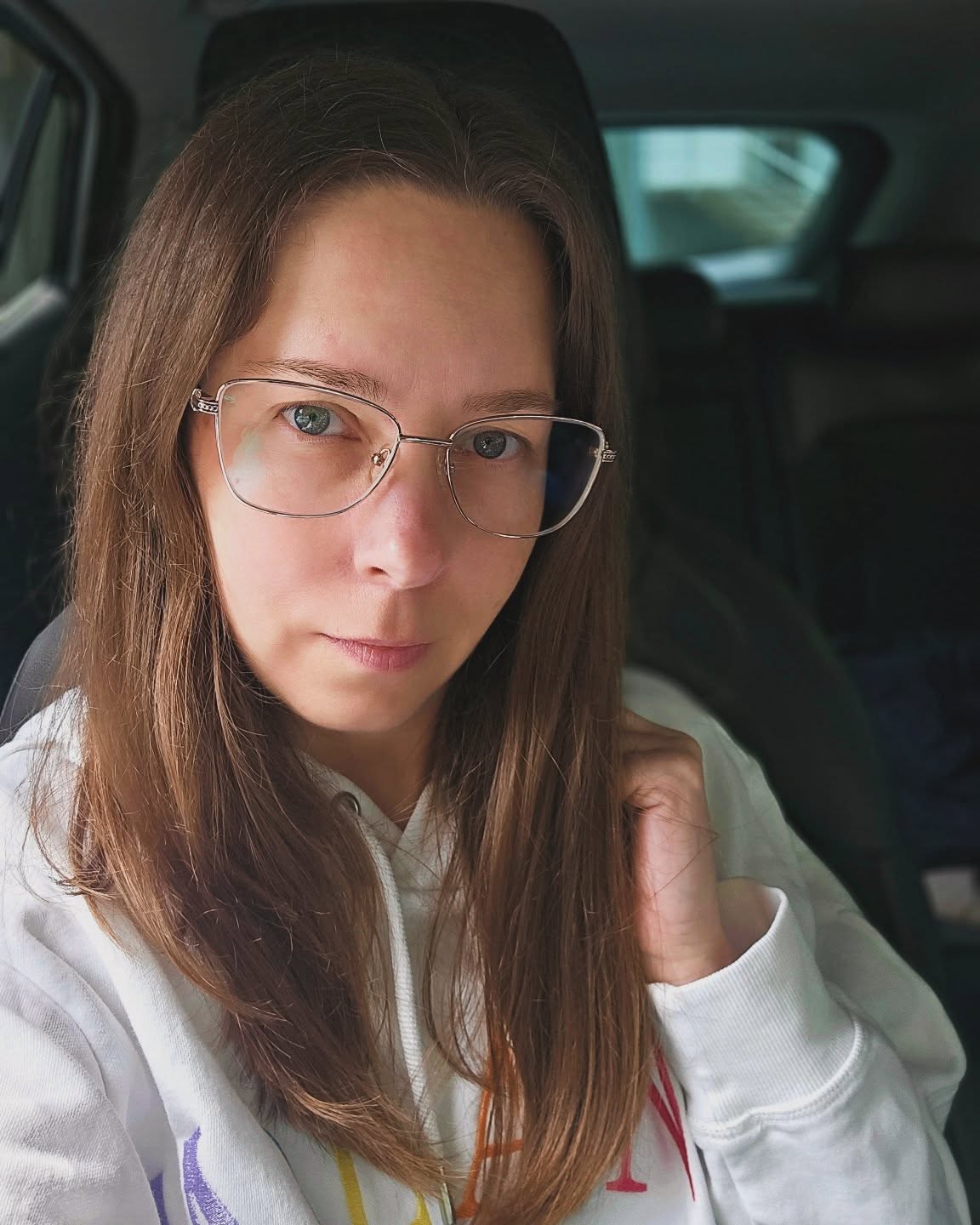 long-brown-hair-with-thin-but-big-glasses