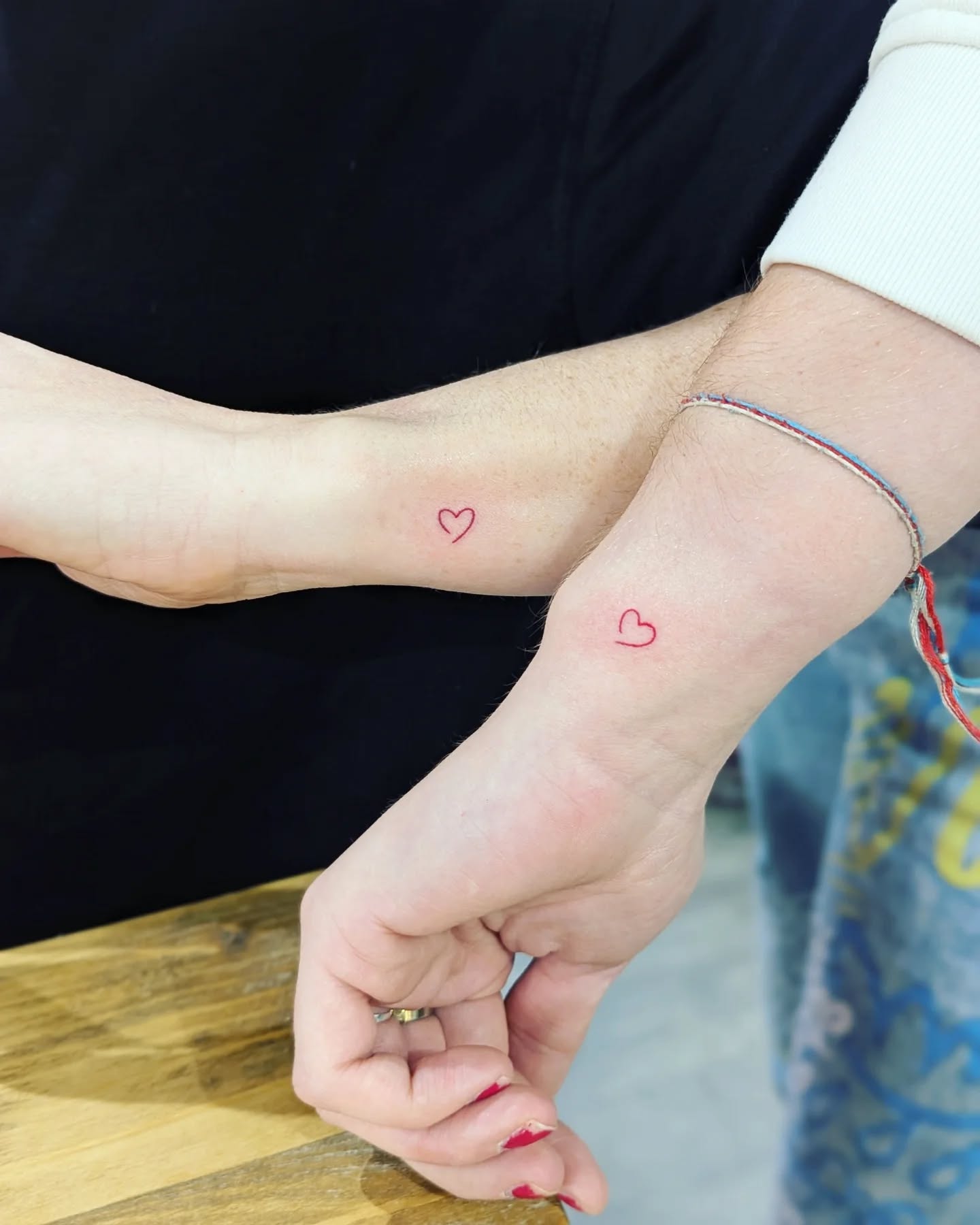 small-red-heart-tattoo-on-wrist