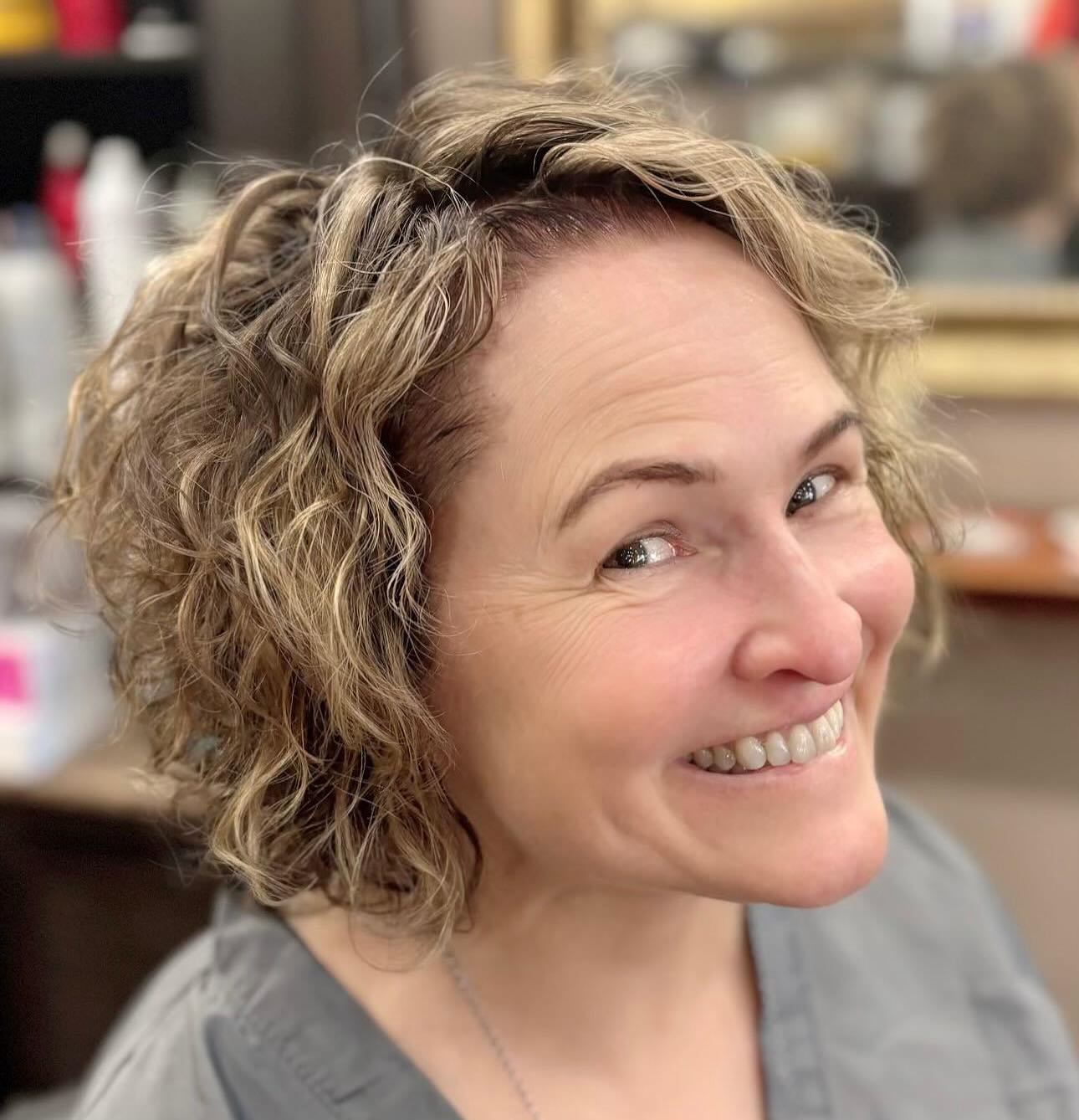 layered-curly-bob-with-blonde-balayage-highlights