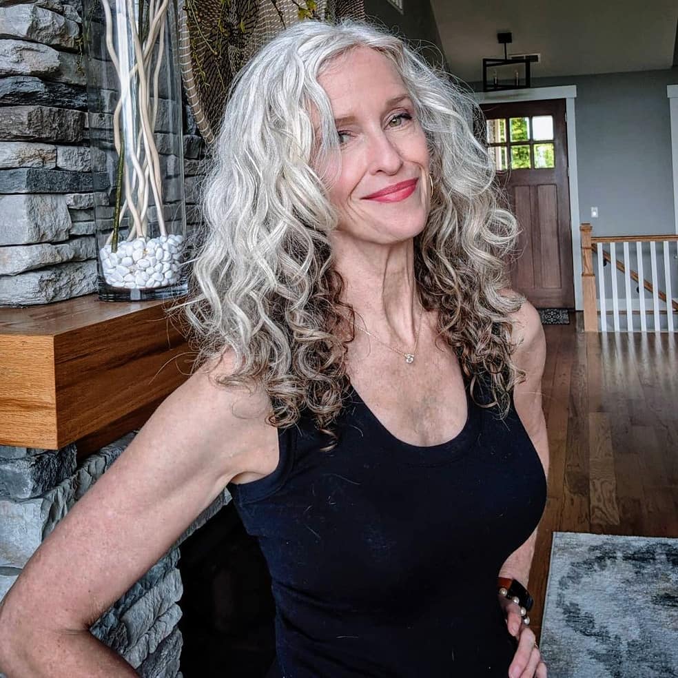 sidepartedcurlywhitehair