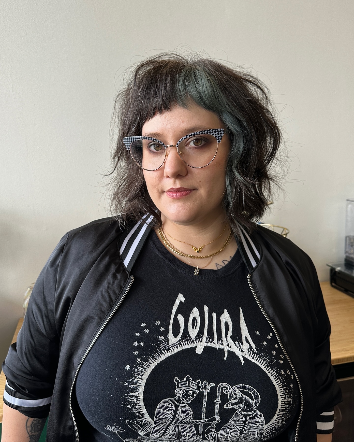 layered-bob-with-ash-blonde-highlights-and-glasses