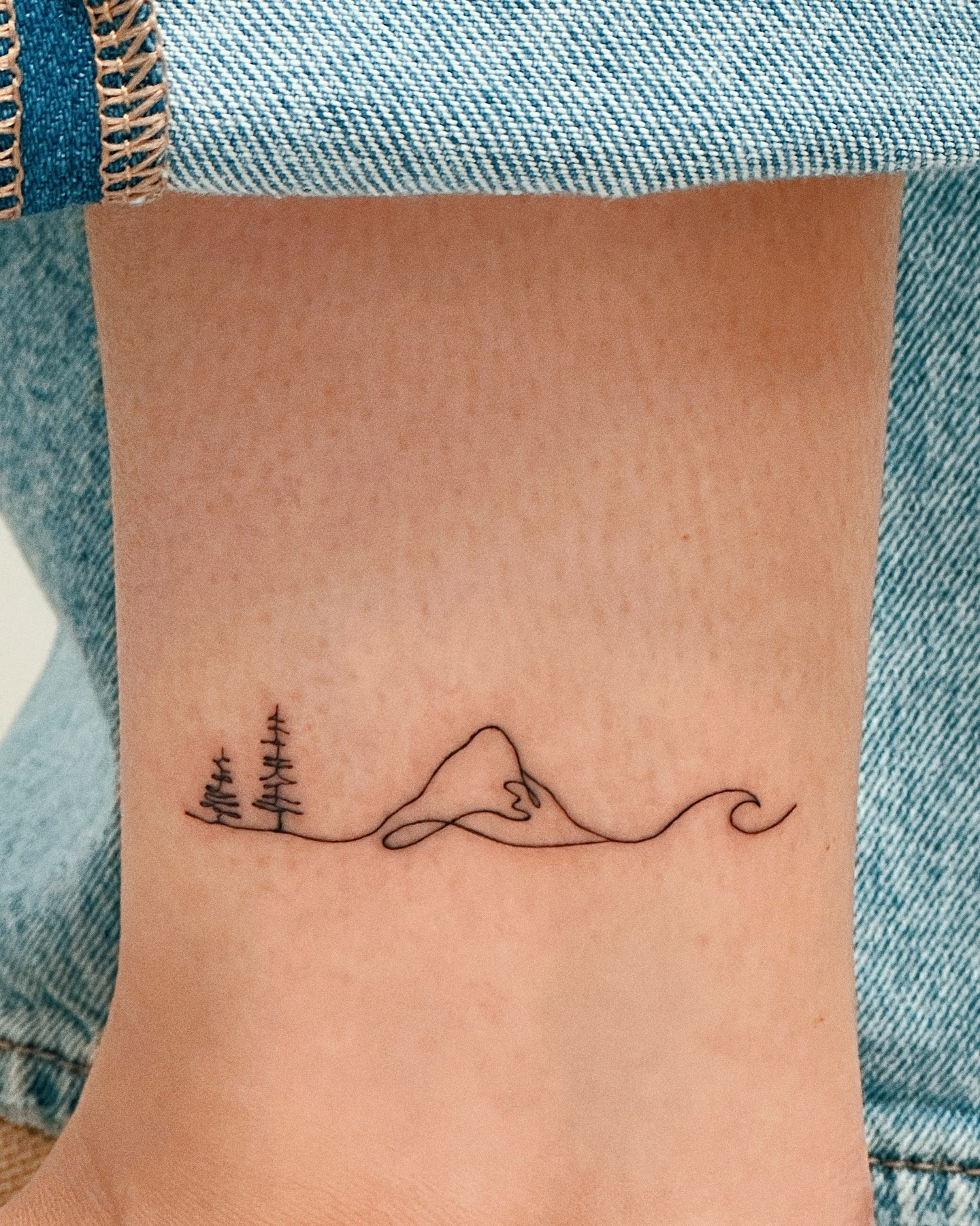 mountain-trees-and-waves-tattoo