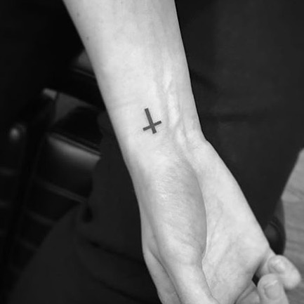 small-cross-tattoo-on-wrist