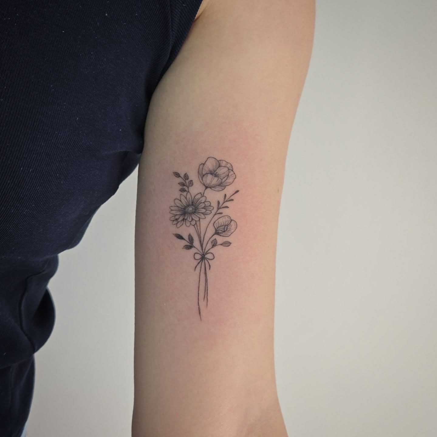 single-needle-flower-tattoo