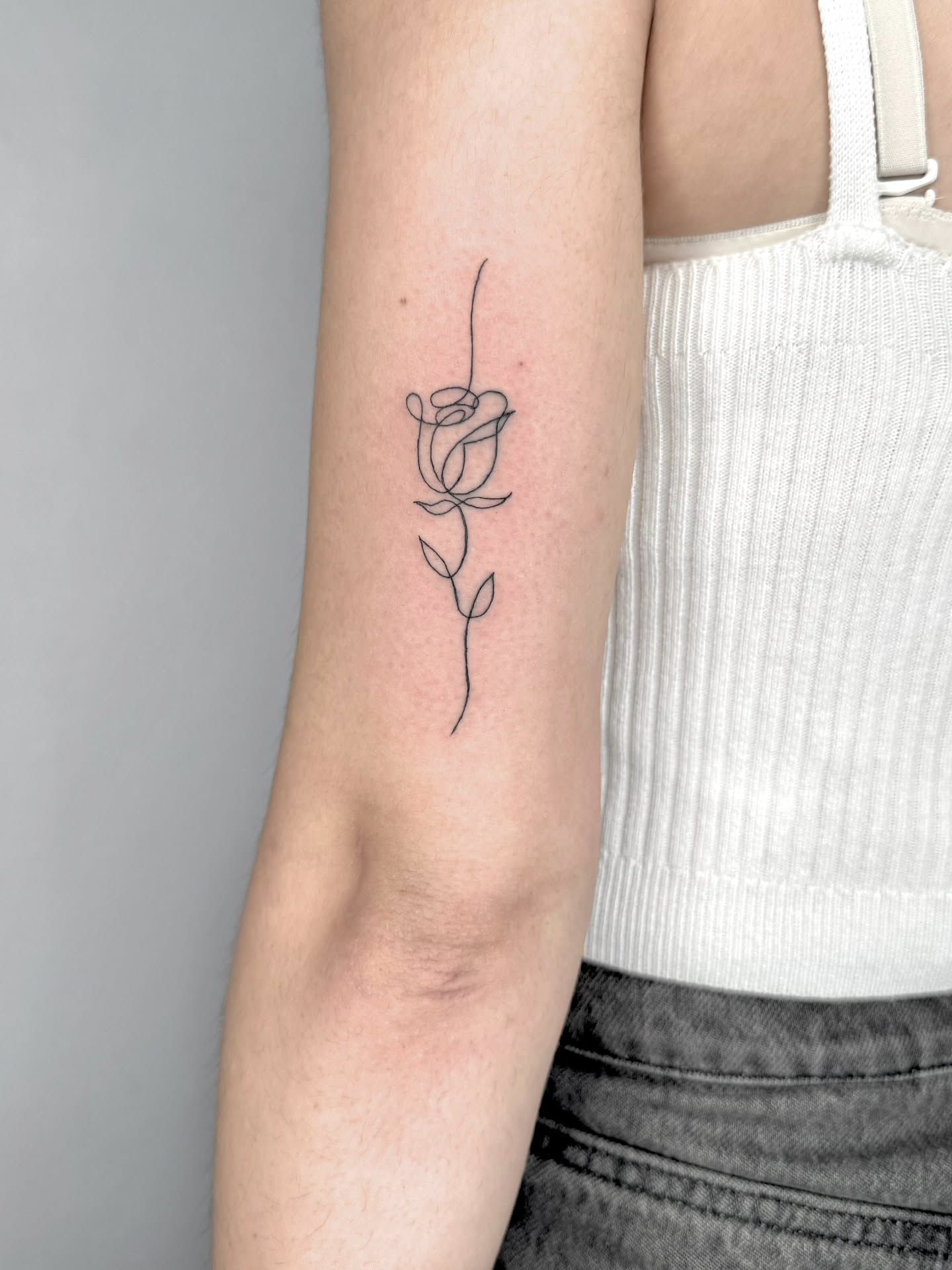black-flower-tattoo-on-arm