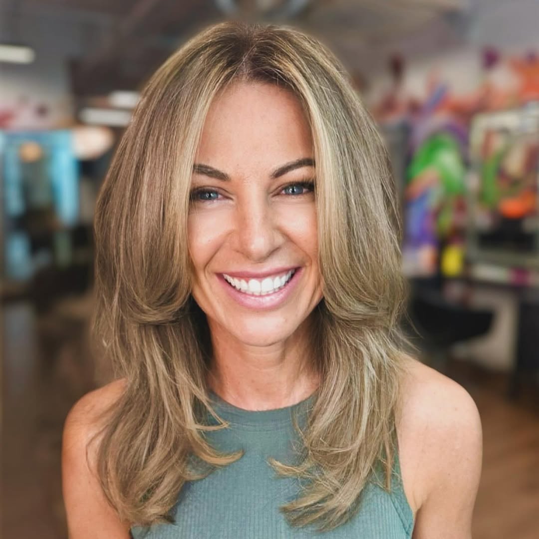 Long Layered Haircut with Long Curtain Bangs