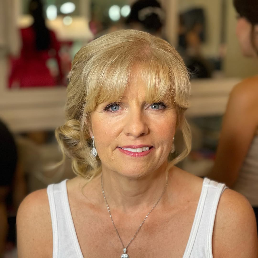 Twisted Low Bun with Front Layers and Fringes