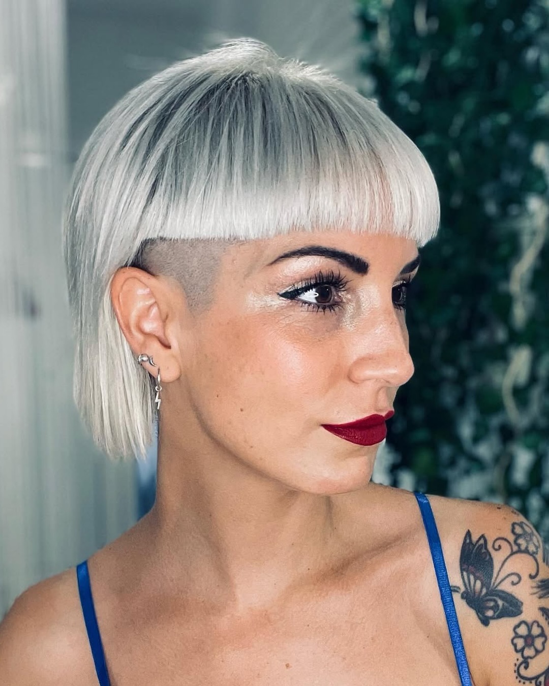 platinum-blonde-hair-with-bangs-and-shaved-sides