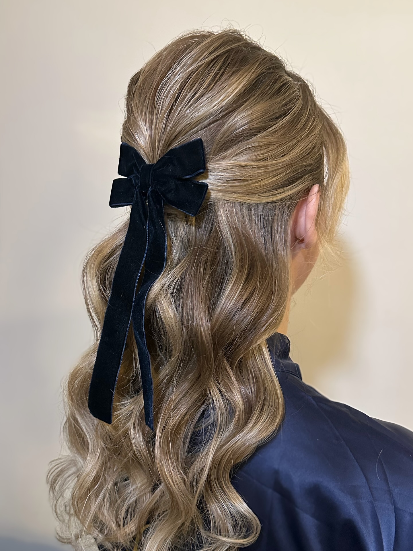 textured-half-updo-with-velvet-bow
