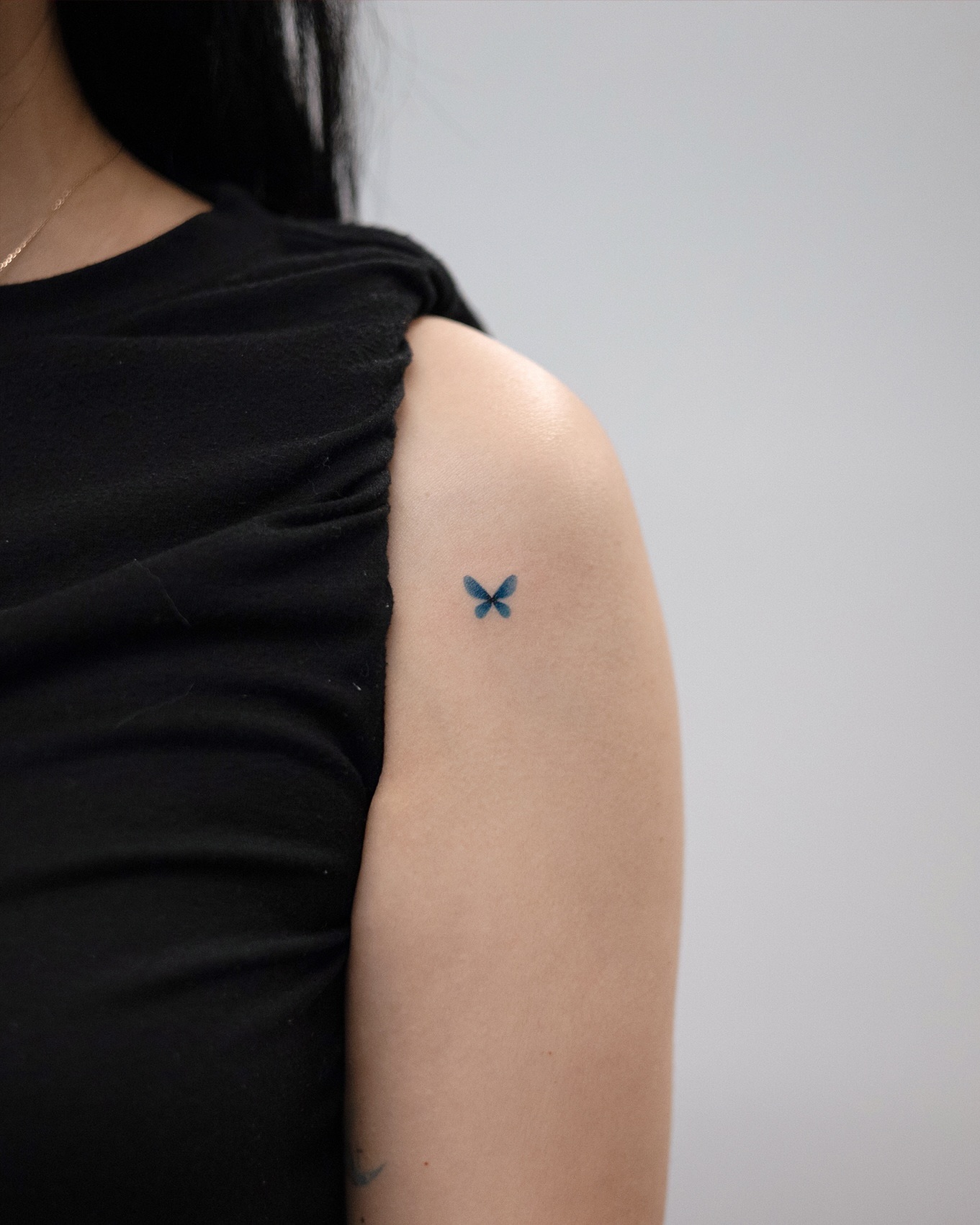 tiny-blue-butterfly-tattoo